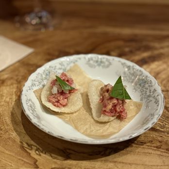 Barley Swine signature dishes Shiitake Dumplings
Pig Face Parker House Roll
Aged Beef Tartare